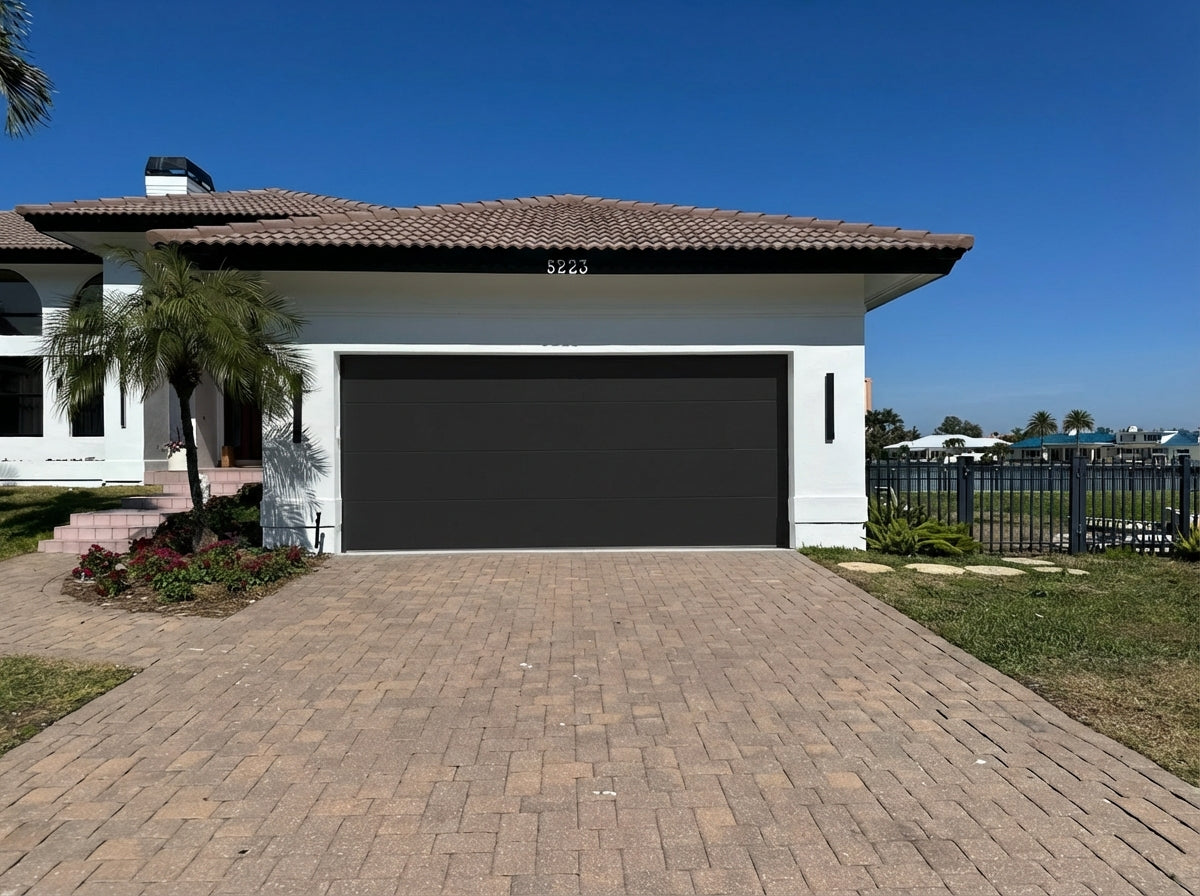 Modern Flush Panel - Hurricane Rated in Black installed on a home (double-car)