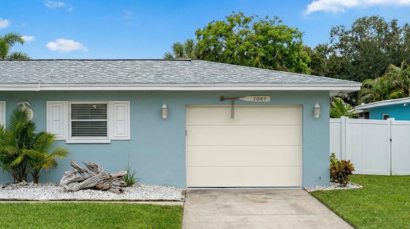 Modern Flush Panel - Hurricane Rated in Almond installed on a home (single-car)