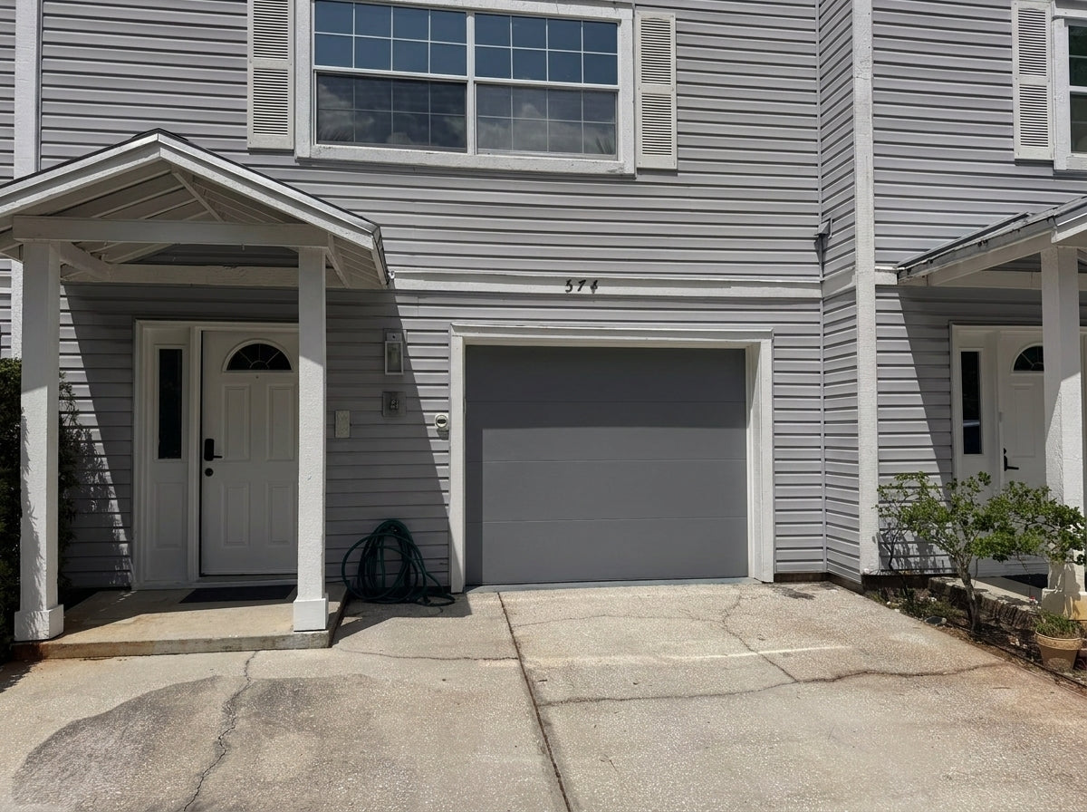Modern Flush Panel - Hurricane Rated in Gray installed on a home (single-car)