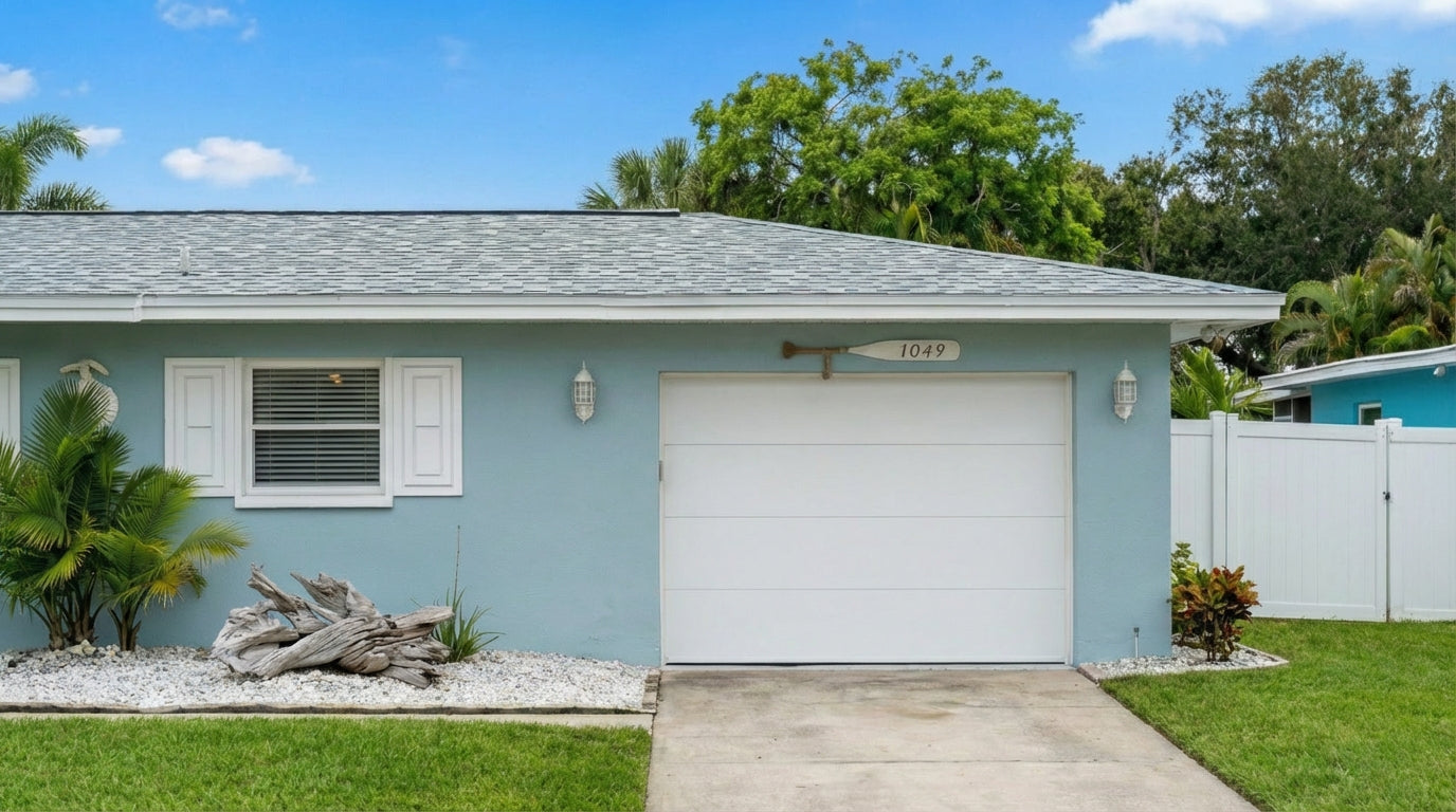 Classic Short Raised Panel - Hurricane Rated in Almond installed on a home (single-car)